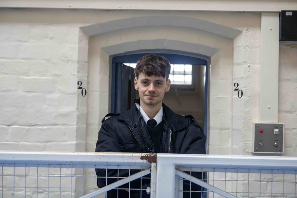 Cove Group team member standing in a doorway inside a building.