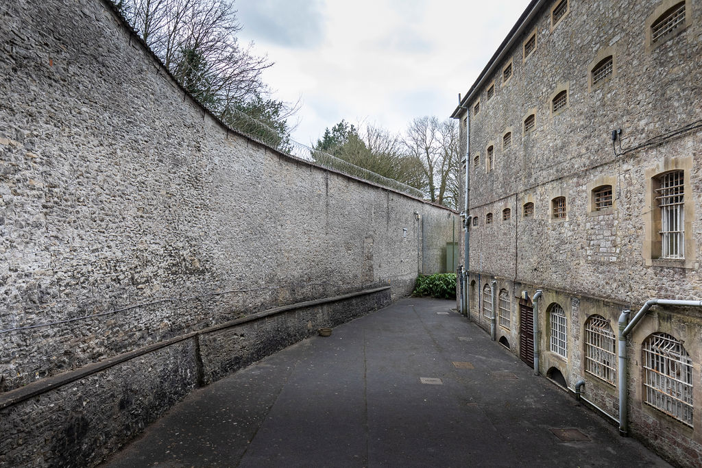 High Prison Walls - Cove Group